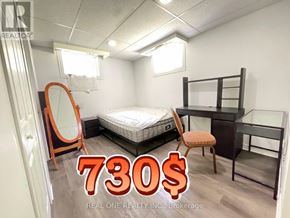 Hamilton (Ainslie Wood) apartment for rent - A bedroom with a bed, desk, and chair is on sale for 730 dollars.