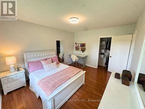 London North (North G) apartment for rent - A bedroom with a large bed and a small table.