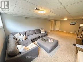 London North (North G) apartment for rent - A living room with a grey couch and a grey ottoman.