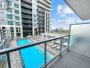 Vaughan (Vaughan Corporate Centre) condo for rent - A balcony with a pool and a view of the city.