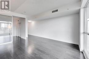Toronto (Thorncliffe Park) condo for rent - A spacious room with a grey floor and white walls.