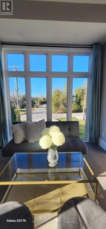 Oro-Medonte apartment for rent - A living room with a glass table and a sofa.