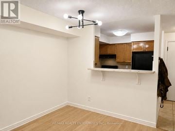 Toronto (West Humber-Clairville) condo for rent - A room with a ceiling fan and a counter with a microwave.