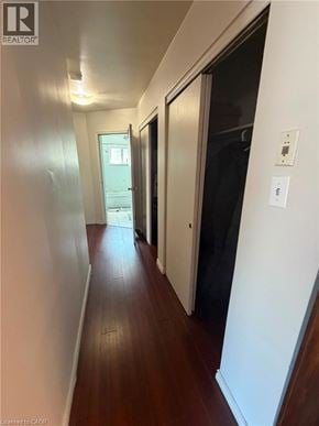 Waterloo apartment for rent - A hallway with a door on the right and a window in the distance.