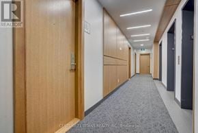 Toronto (Henry Farm) condo for rent - A hallway with doors on both sides and a carpeted floor.