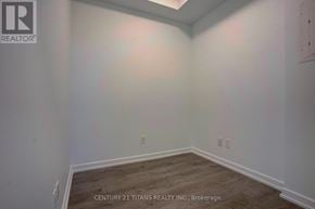 Toronto (Henry Farm) condo for rent - A room with wooden flooring and white walls, with a logo and text indicating it is a brokerage for Century 21 Titans Realty Inc.