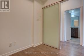 Toronto (Henry Farm) condo for rent - A room with a sliding door leading to another room.