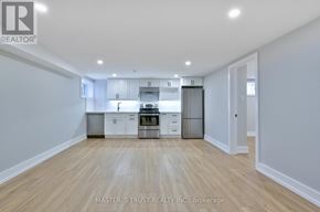 Oakville (Co Central) apartment for rent - A kitchen with white cabinets and a wooden floor.