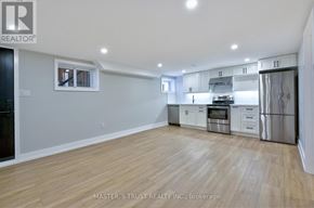Oakville (Co Central) apartment for rent - A kitchen with white cabinets and stainless steel appliances.