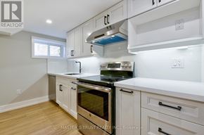 Oakville (Co Central) apartment for rent - A kitchen with white cabinets and a stainless steel oven.