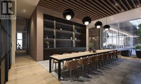 Brampton (Bram East) condo for rent - A modern dining room with a long table and chairs.