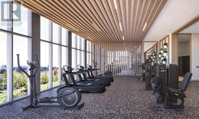 Brampton (Bram East) condo for rent - A gym with a row of treadmills and exercise bikes.