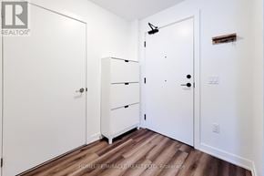 Hamilton (Lakeshore) condo for rent - A white closet with a shelf and a door with a black handle.