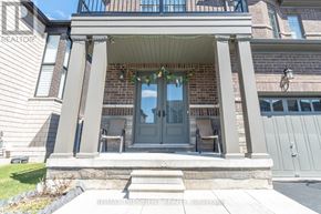 Woodstock (Woodstock - North) apartment for rent - A house entrance with a glass door and steps leading up to it.