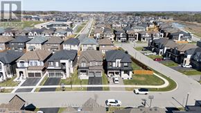 Woodstock (Woodstock - North) apartment for rent - A suburban neighborhood with houses and parked cars.