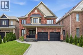 Niagara Falls apartment for rent - A large, two-story house with a brick facade and a garage.