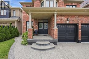 Niagara Falls apartment for rent - A house with a black garage door is for sale.