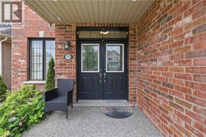 Niagara Falls apartment for rent - A black door with a glass window is on a brick wall.