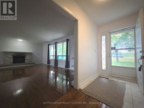 King apartment for rent - A room with a fireplace and sliding glass doors.