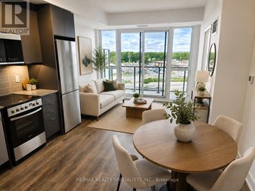 Milton (Tm Timberlea) condo for rent - A modern kitchen with a dining table and chairs.