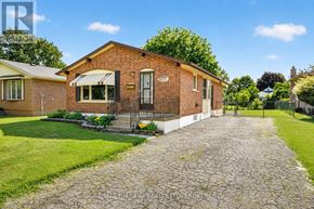 Niagara Falls (Arad/Fallsview) apartment for rent - A brick house with a cobblestone pathway leading to the front door.