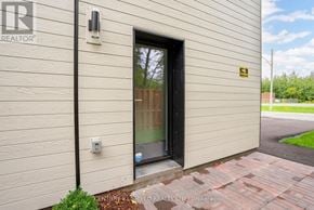 South Glengarry apartment for rent - A building with a door and a sign that says REALTOR.