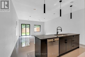 South Glengarry apartment for rent - A modern kitchen with a sink and cabinets.