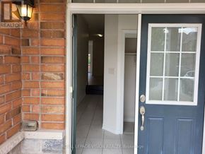 Milton (Be Beaty) apartment for rent - A blue door with a glass window is open to a hallway.