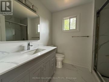 Oakville (Ga Glen Abbey) apartment for rent - A bathroom with a sink, toilet and a window.