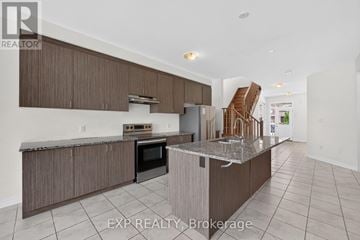 Cambridge apartment for rent - A kitchen with a stove top oven and a refrigerator.