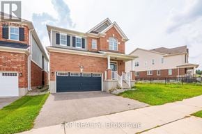Cambridge apartment for rent - A house with a brick facade and a white garage door is for sale.