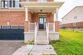 Cambridge apartment for rent - A house with a black door and a sign that says "REALTOR" on the wall.