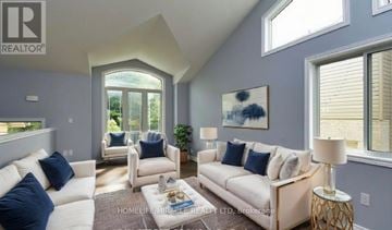 Niagara Falls (Oldfield) apartment for rent - A living room with white furniture and a large window.