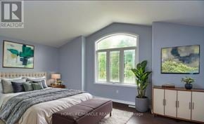 Niagara Falls (Oldfield) apartment for rent - A bedroom with a large bed, a window, and a painting on the wall.