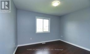 Niagara Falls (Oldfield) apartment for rent - A room with a window and a ceiling light.