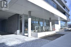 Toronto (Downsview-Roding-Cfb) condo for rent - A modern building with a glass facade and a sign that reads "REALTOR".