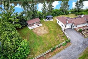 Alfred And Plantagenet apartment for rent - A house with a red roof is surrounded by greenery and a pond.