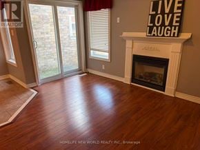 Ajax (South East) townhouse for rent - A living room with a fireplace and a sign that says "Live Love Laugh".