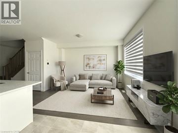 Breslau townhouse for rent - A living room with a white sofa set and a coffee table.
