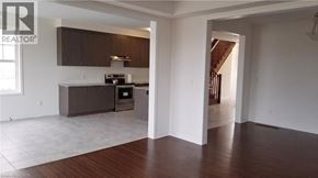 Cambridge apartment for rent - A house with a brick facade and a garage door.