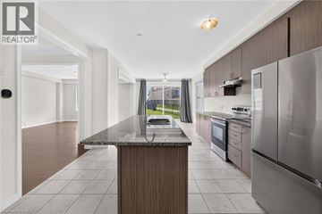 Cambridge apartment for rent - A modern kitchen with stainless steel appliances and a central island.