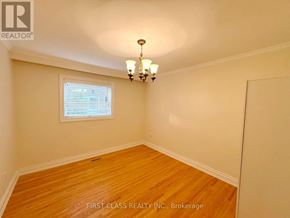 Mississauga (Lakeview) apartment for rent - A room with wooden floors and a chandelier.