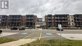 Clearview (Creemore) condo for rent - A parking lot in front of a building with a sign that says REALTOR.