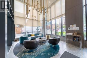 Toronto (Willowdale East) condo for rent - A modern office lobby with a large glass wall and a reception desk.
