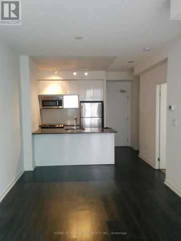 Toronto (Henry Farm) condo for rent - A kitchen with a refrigerator, microwave, and oven.