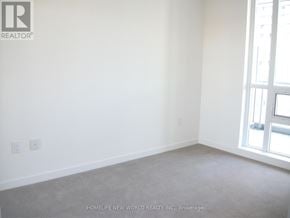Toronto (Henry Farm) condo for rent - A room with a carpeted floor and a window.