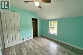 Brantford apartment for rent - A room with a ceiling fan and a window.