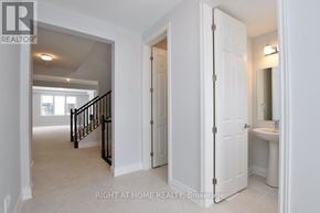 Ottawa apartment for rent - A white bathroom with a toilet and sink is shown.