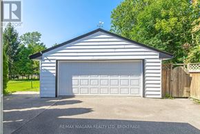 Port Colborne (Sugarloaf) apartment for rent - A garage with a white door and a grey roof is shown in the image.