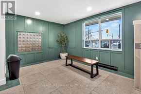 Brantford condo for rent - A room with a bench, a plant, and a calendar on the wall.